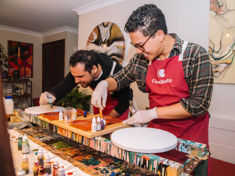 Men making their own resin artworks